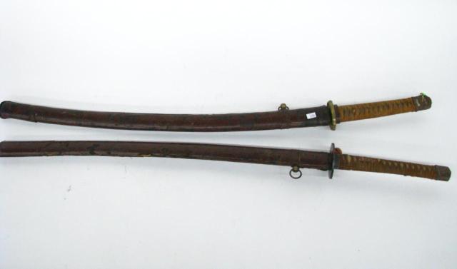 Appraisal: Two Japanese-style swords cloth-wrapped handles no proof marks on blades