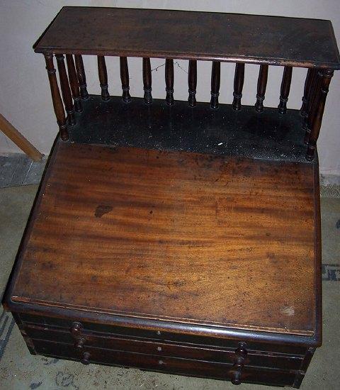 Appraisal: A clerk's early th Century mahogany writing slope the galleried