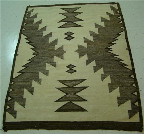 Appraisal: NAVAJO RUG with diamond and x-form pattern in beige and