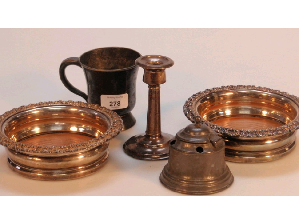 Appraisal: A pair of electroplate wine coasters silver candle stick pewter