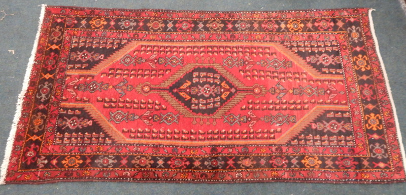 Appraisal: A modern Persian type rug with a central pole medallion