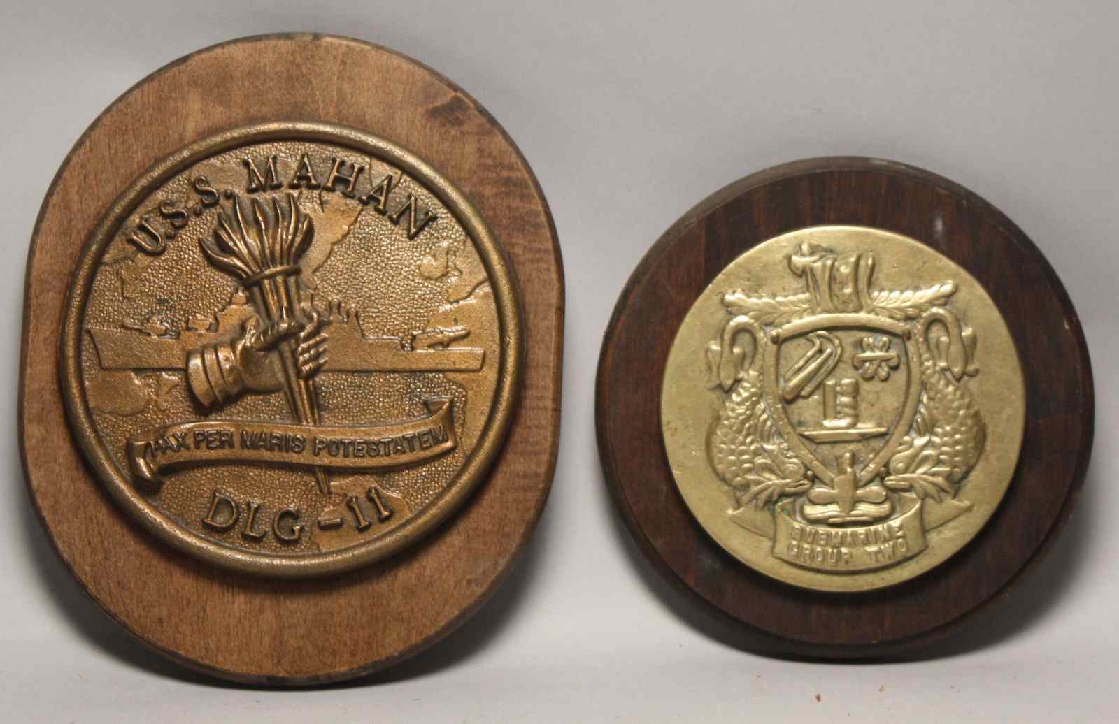 Appraisal: TWO BRONZE NAVAL PLAQUESOne marked Submarine Group Two'' diameter ''