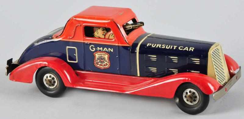 Appraisal: Pressed Steel Marx G-Man Pursuit Wind-Up Toy Description American Working