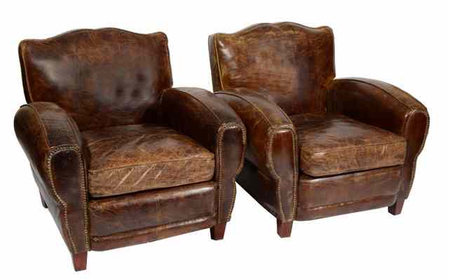 Appraisal: A PAIR OF CONTEMPORARY BROWN LEATHER ARMCHAIRS standing on square