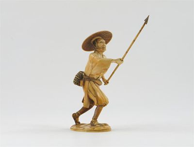 Appraisal: A Japanese ivory carving of a peasant wearing a wide-brimmed