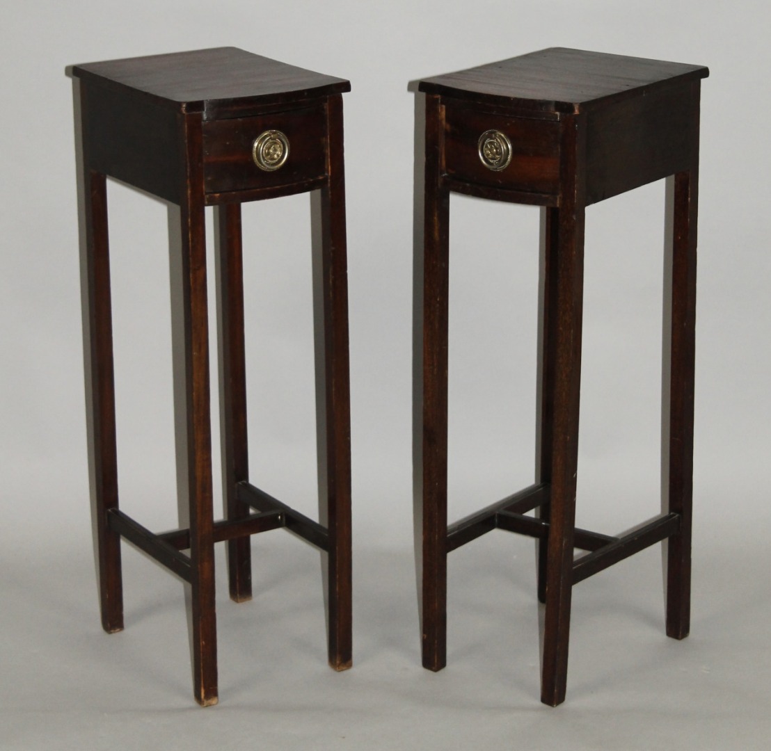 Appraisal: A pair of Edwardian mahogany side tables each bow fronted