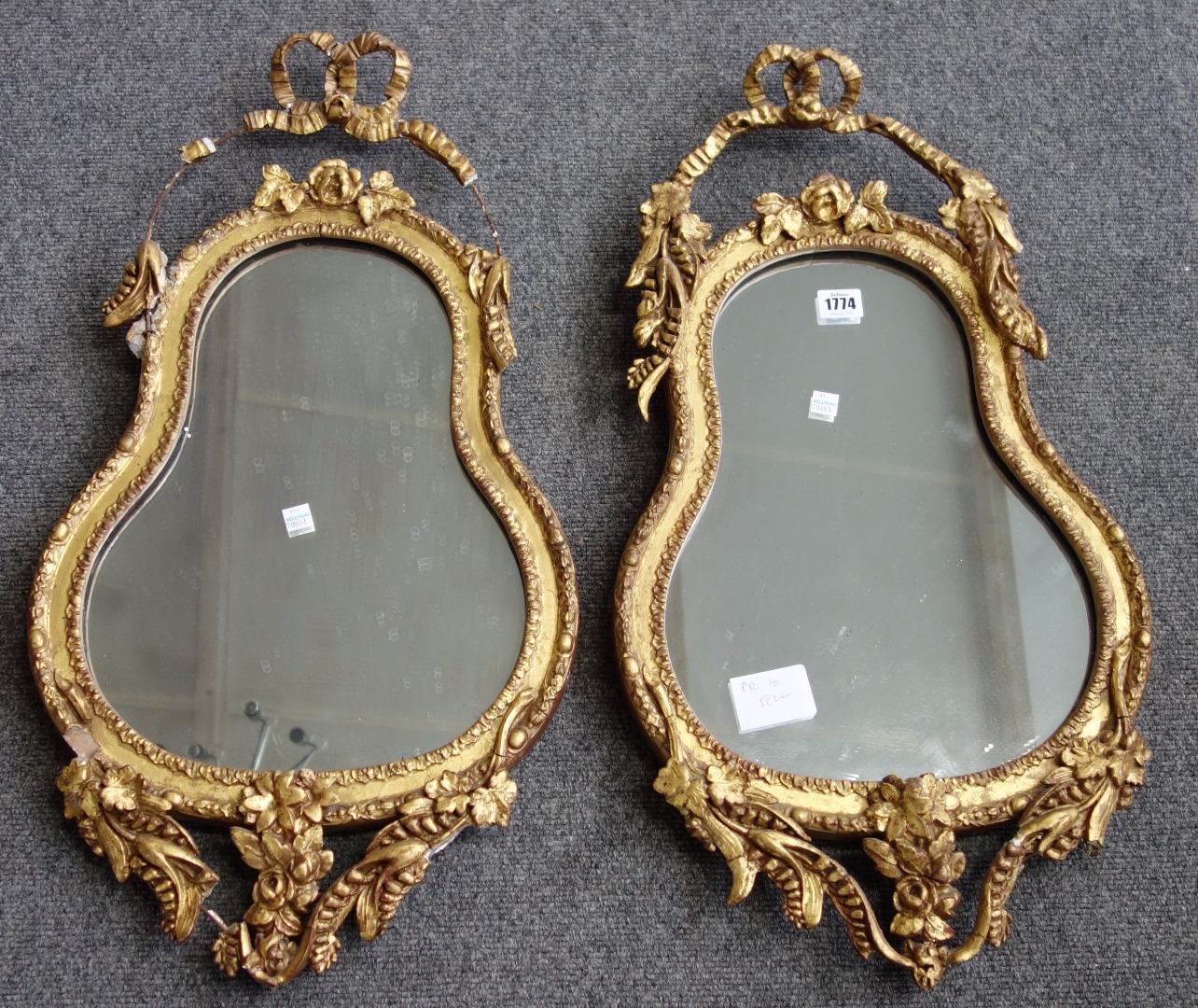 Appraisal: A pair of th century gilt framed wall mirrors with