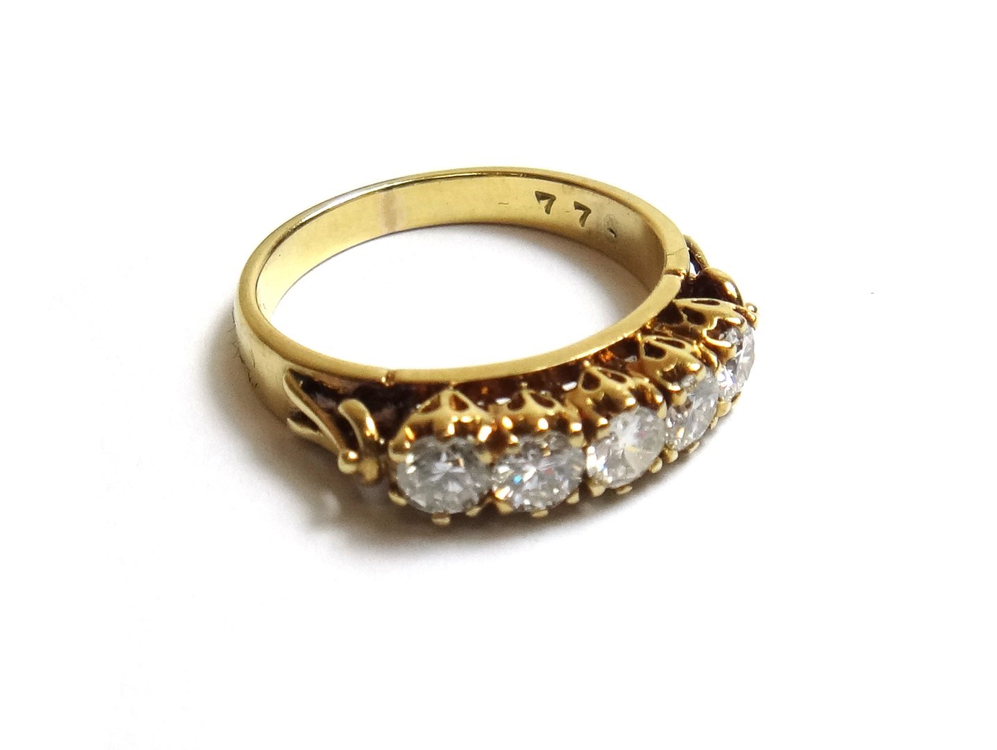 Appraisal: A gold and diamond set five stone ring claw set