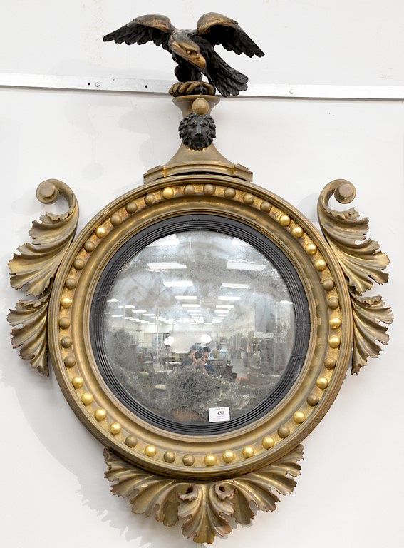 Appraisal: Federal convex mirror having ebonized eagle crest and foliate carved