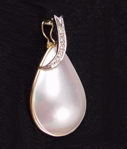 Appraisal: MABE' PEARL AND DIAMOND ENHANCER K yellow gold enhancer contains