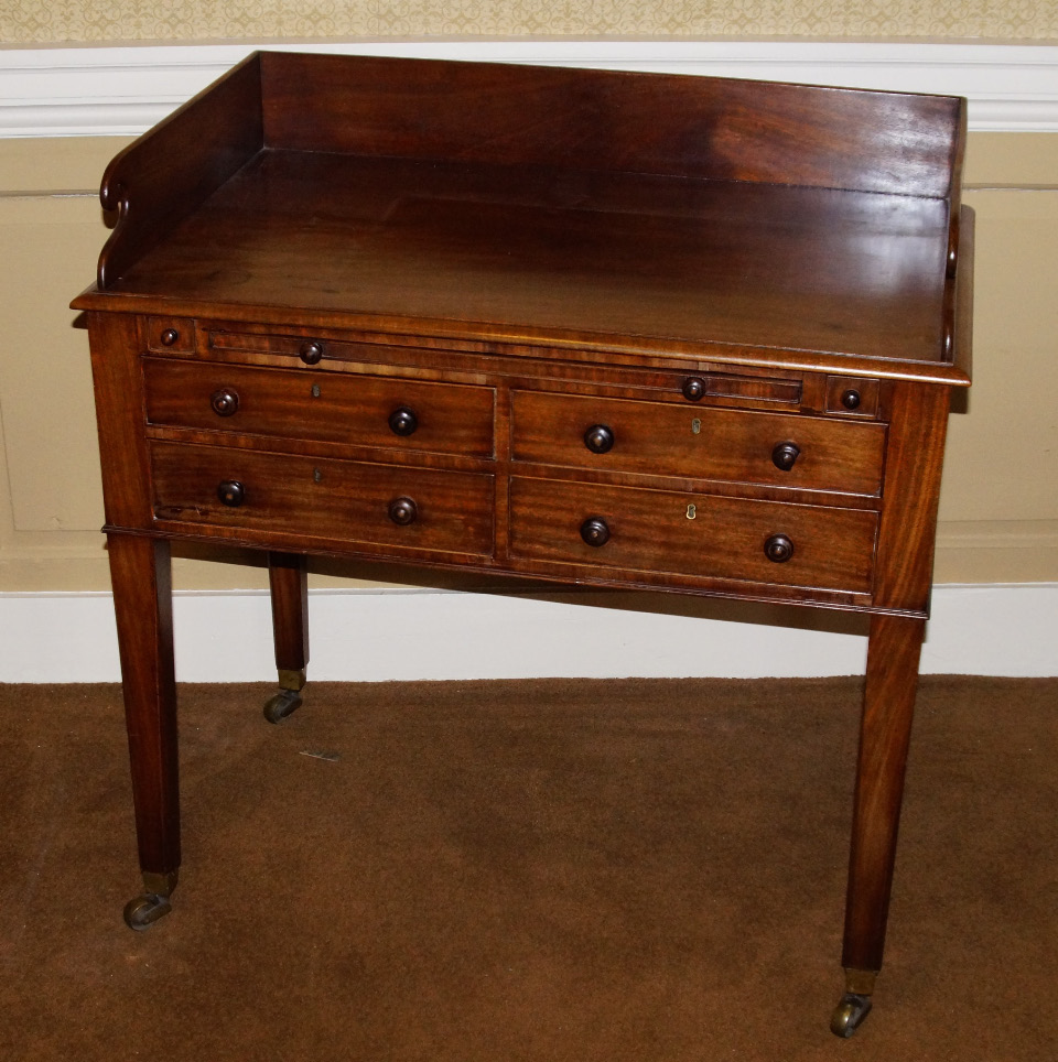 Appraisal: A late George III mahogany dressing table with a raised