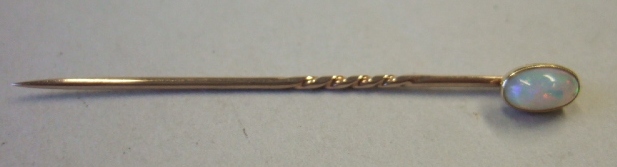 Appraisal: A gold mounted oval opal stick pin cased