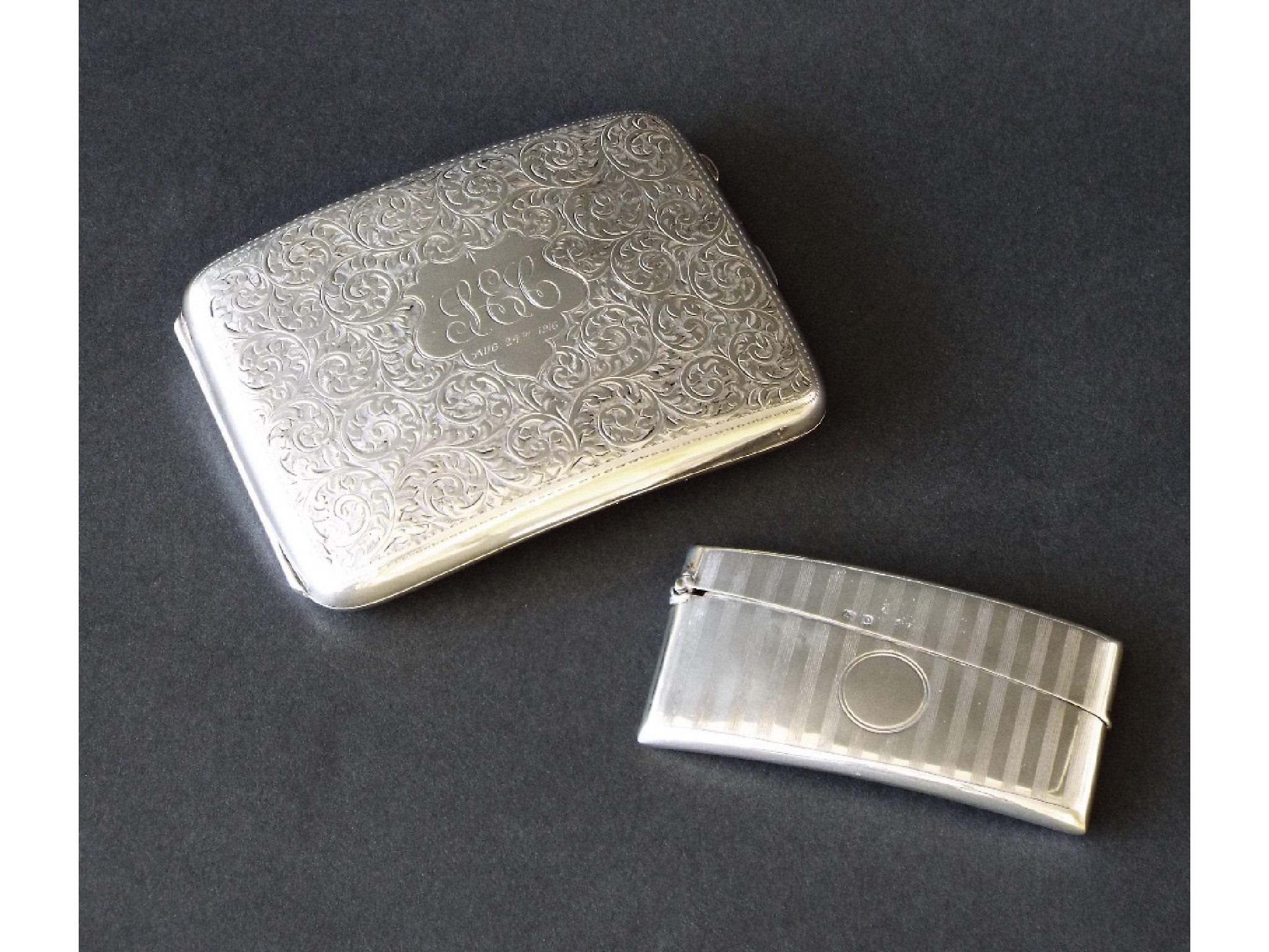 Appraisal: Early th century silver hip shaped cigarette case engraved with