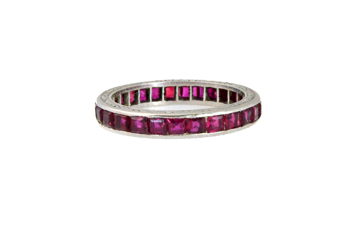 Appraisal: A platinum and ruby set eternity ring with channel set