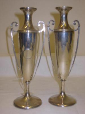 Appraisal: A PAIR OF EDWARDIAN VASES of slender urn form with