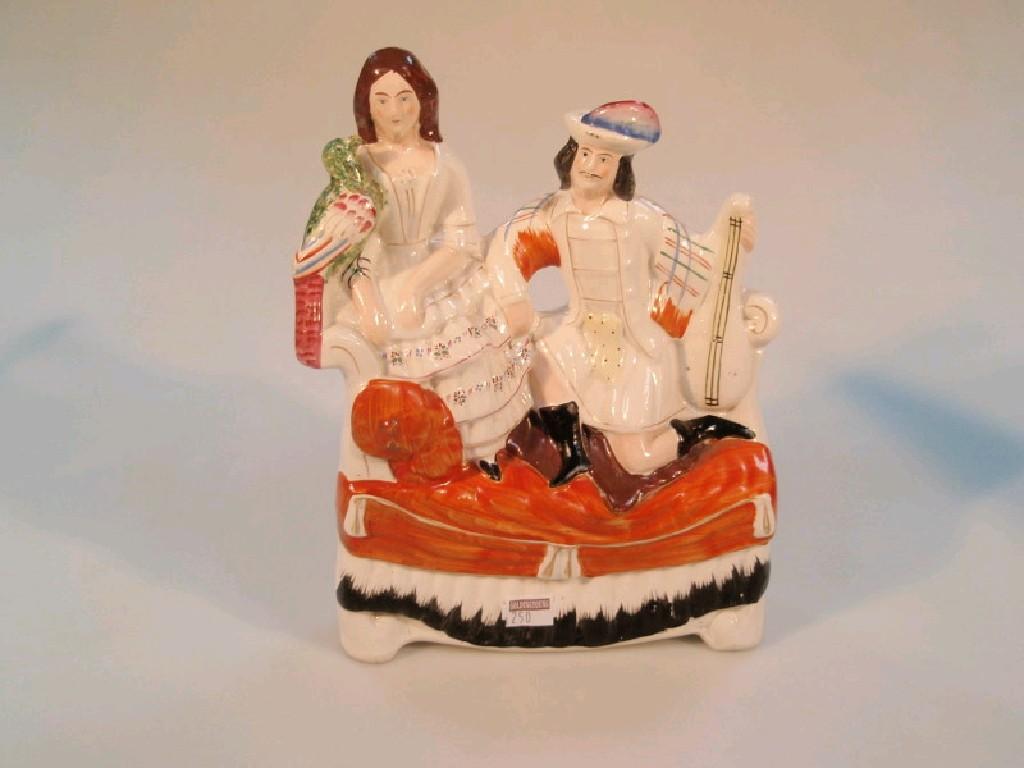 Appraisal: A thC Staffordshire pottery figure group of a courting couple