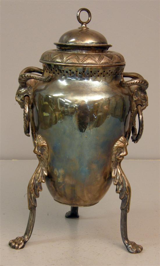 Appraisal: Silver plated samovar with twin rams head handles raised on