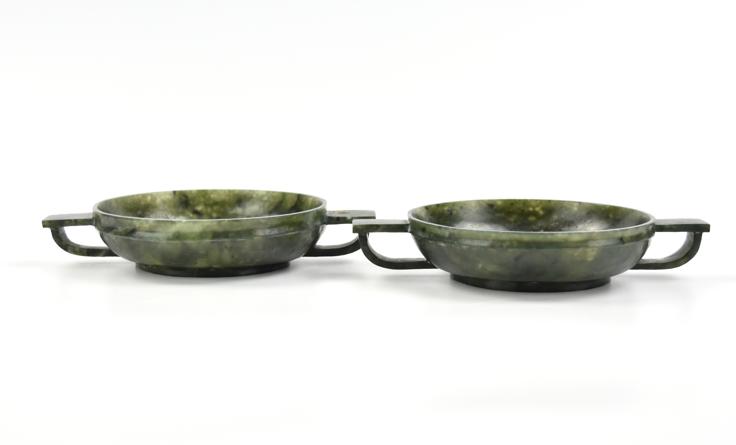 Appraisal: Chinese th C of green jade circular dish supported with