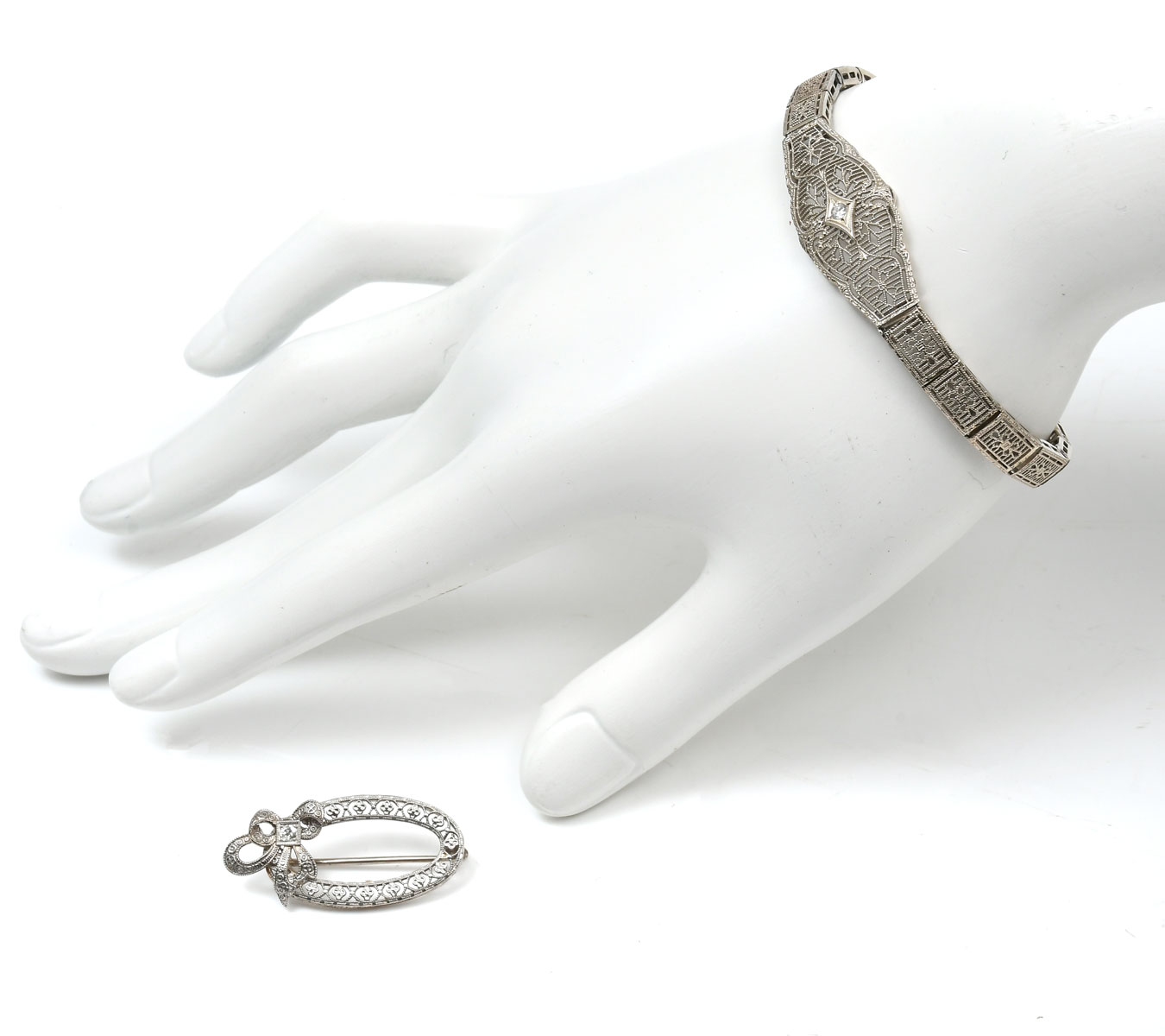 Appraisal: K WHITE GOLD BRACELET BY ESEME BROOCH K bracelet contains