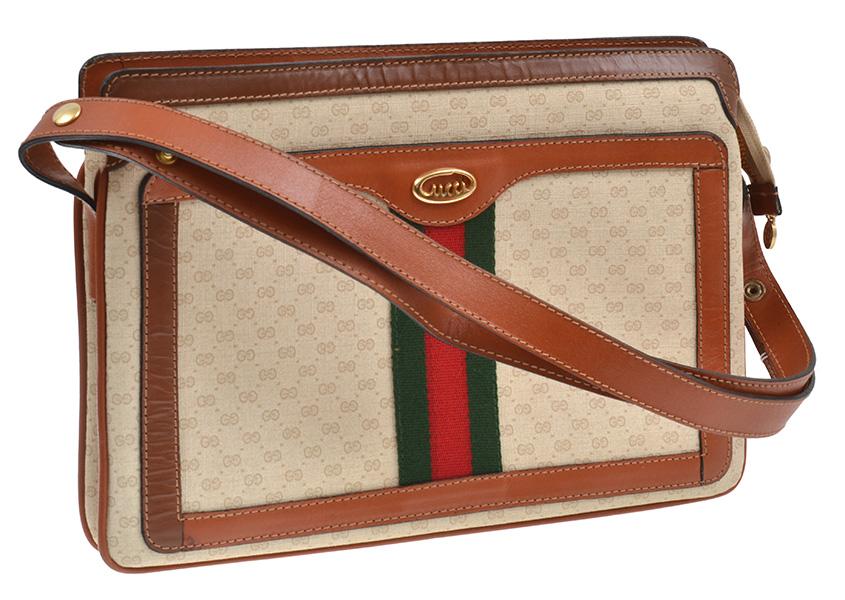 Appraisal: A GUCCI BAG CIRCA Styled in Monogram canvas with tan