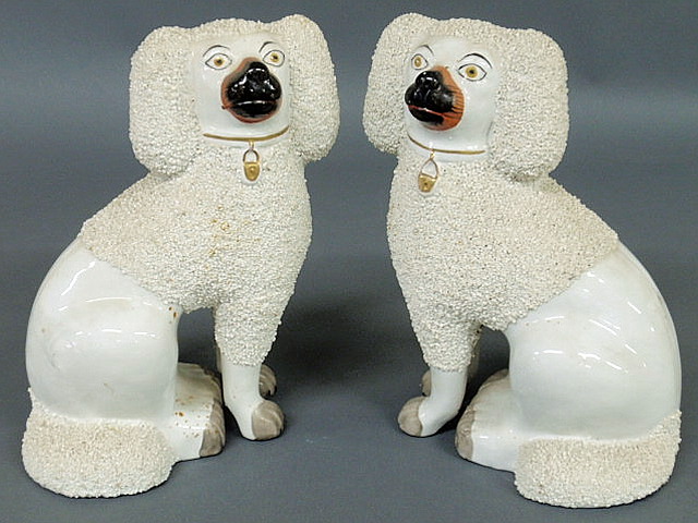 Appraisal: Pair of Staffordshire white seated poodles late th c h