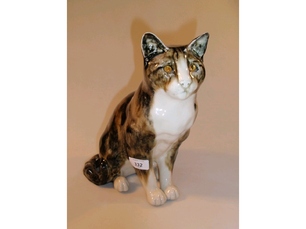 Appraisal: A pottery model of a seated tabby cat by Mike