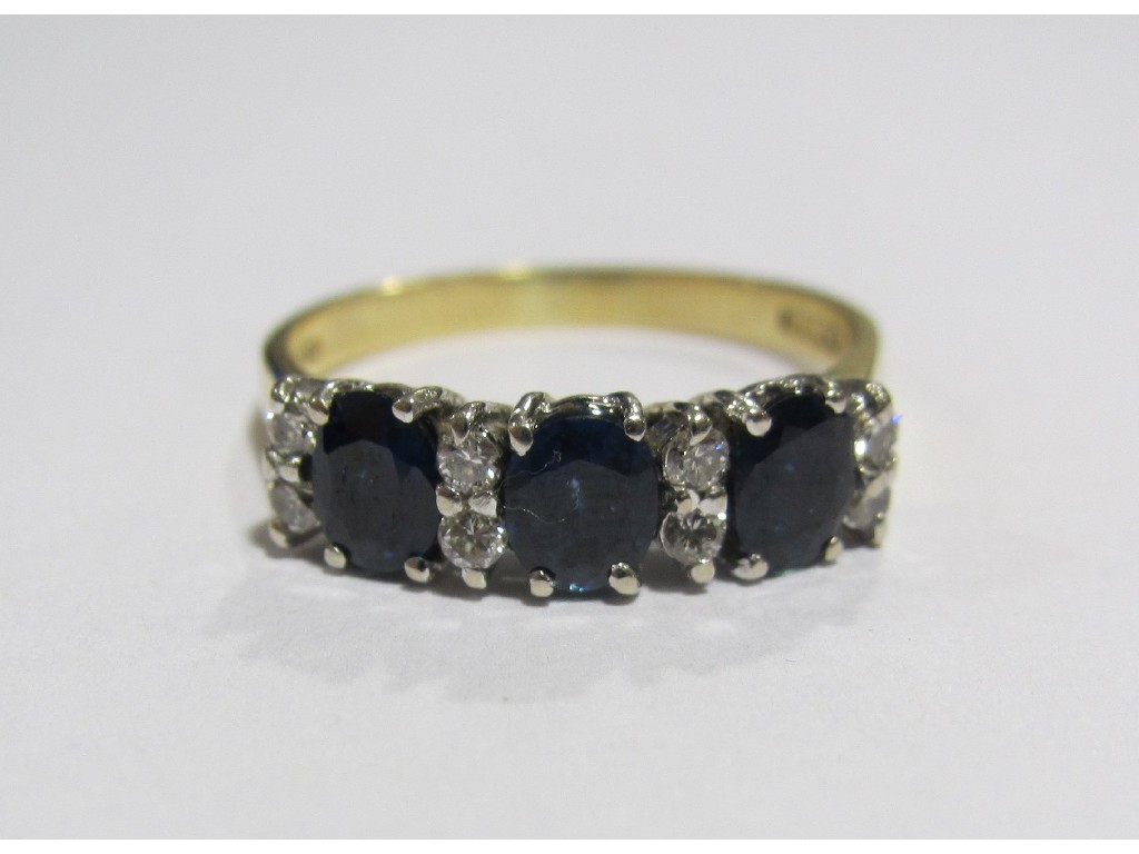 Appraisal: Eighteen carat gold sapphire and diamond set dress ring with