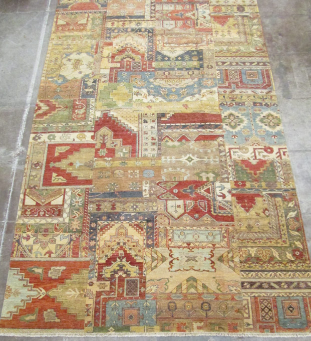 Appraisal: HAND KNOTTED ORIENTAL CARPET featuring a prayer rug mosaic panel