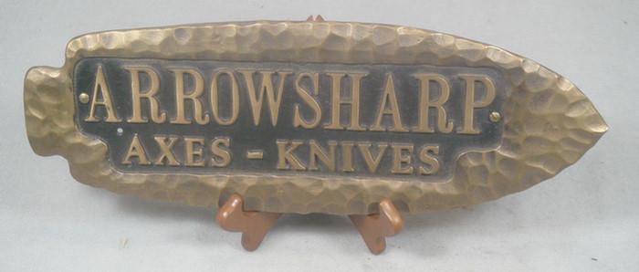 Appraisal: Cast iron hanging advertising wall piece reads Arrowsharp Axes -