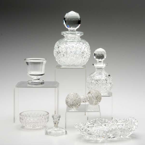 Appraisal: CUT GLASS Seven pieces two bottles with faceted stoppers rectangular