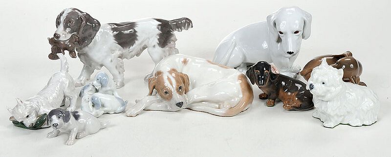 Appraisal: Nine Assorted Porcelain Dog Figures Continental th century of varying