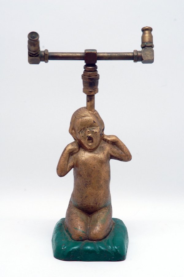 Appraisal: Painted cast iron figural sprinkler in the shape of a