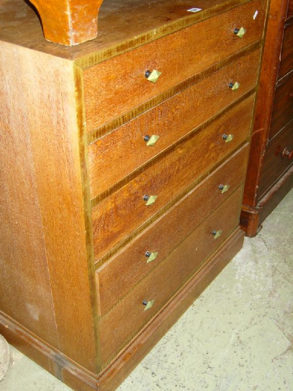 Appraisal: An Art Deco oak chest fitted with five long drawers