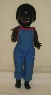 Appraisal: A Pedigree plastic negro baby walking doll with brown sleeping