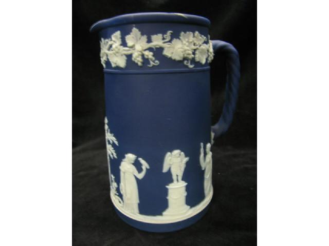 Appraisal: Wedgwood Dark Blue Jasperware Pitcher classical maidens cherub in the