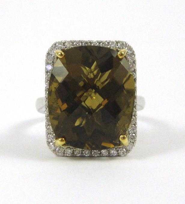 Appraisal: SMOKY TOPAZ AND FOURTEEN KARAT WHITE GOLD RING with round-cut