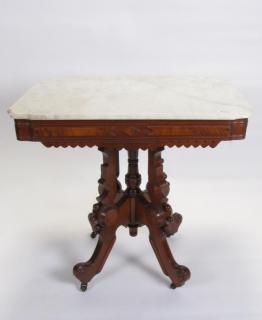 Appraisal: Description A Renaissance Revival style walnut table with white marble