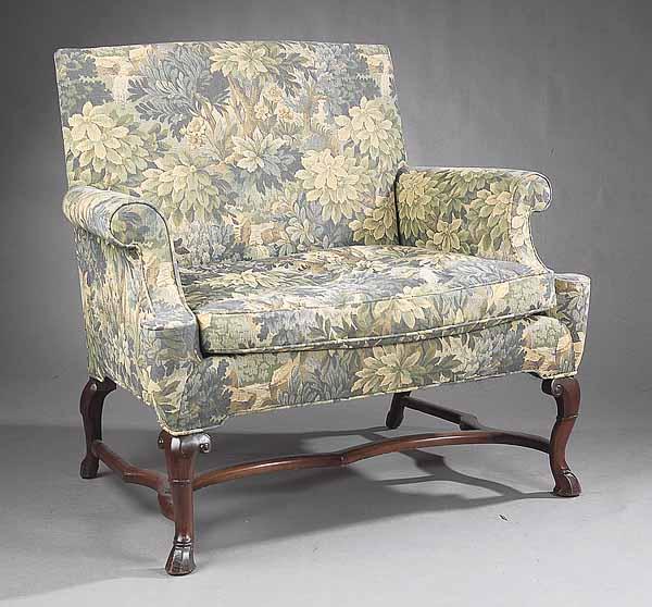 Appraisal: A Queen Anne-Style Carved Mahogany Armchair with rectangular back scrolled