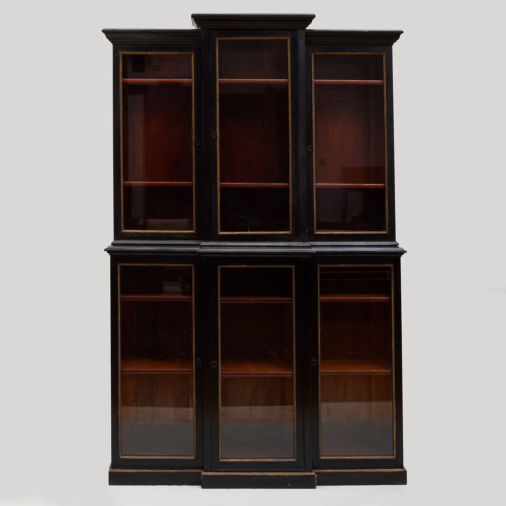 Appraisal: Late Regency Gilt-Metal-Mounted Ebonized Breakfront Bookcase In two parts the