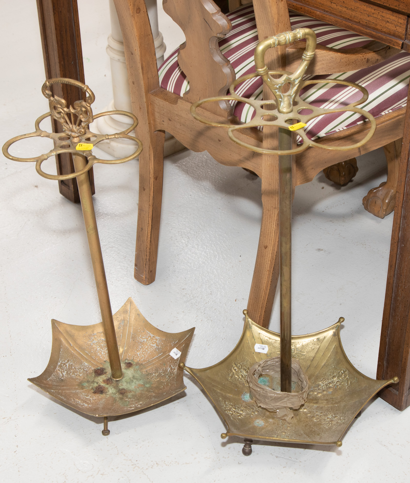 Appraisal: TWO BRASS UMBRELLA HOLDERS One approximately in H the other