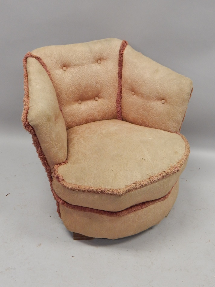 Appraisal: An Art Deco style tub chair upholstered in pink button