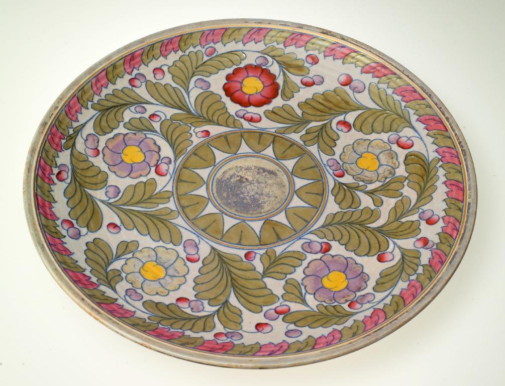 Appraisal: CROWN DUCAL PALERMO POTTERY CHARGER DESIGNED BY CHARLOTTE RHEAD tubelined