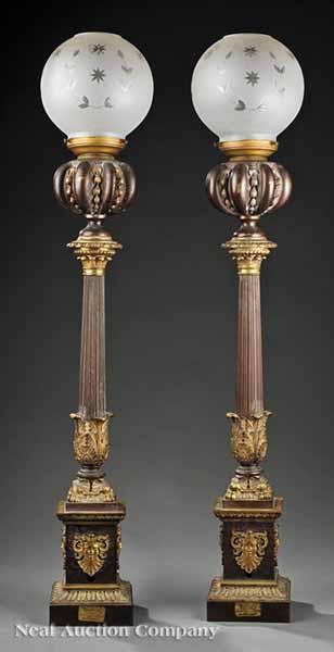 Appraisal: A Pair of Gilt and Patinated Bronze Lamp Standards th