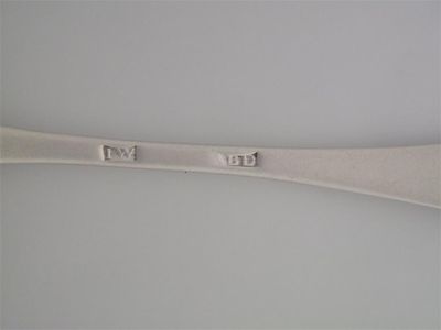 Appraisal: JAMES WILDGOOSE A Hanoverian tablespoon with a double drop crudely