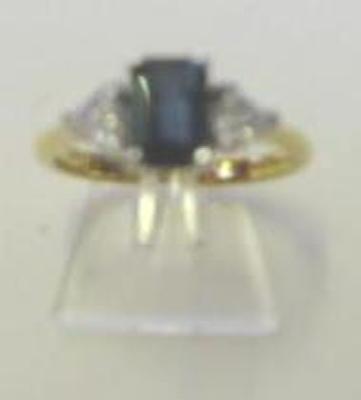 Appraisal: A SAPPHIRE AND DIAMOND THREE STONE RING the emerald cut