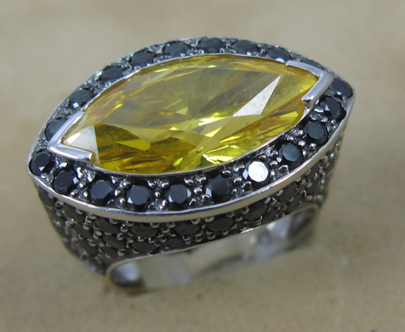 Appraisal: YELLOW ZIRCON AND BLACK DIAMOND RING K white gold setting