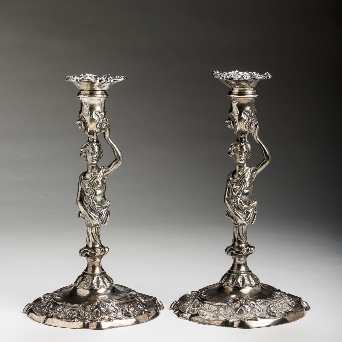 Appraisal: PAIR OF GEORGE II SILVER CRESTED FIGURAL TABLE CANDLESTICKS JOHN