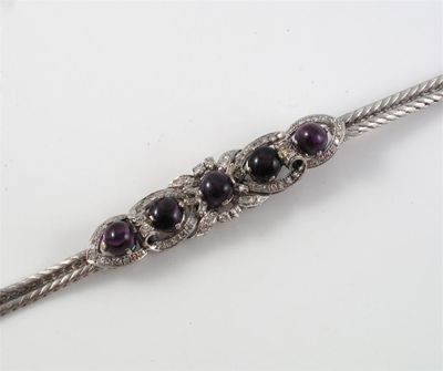 Appraisal: An amethyst and diamond bracelet Set with five amethyst cabochons