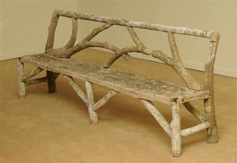 Appraisal: CAST-STONE RUSTICATED TWIG-FORM BENCH The rectangular twig-formed backrest above the