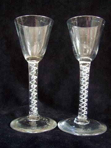 Appraisal: A pair of wine glasses with airtwist stems and circular